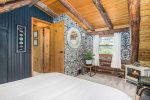 Upper level queen bedroom with an electric fireplace available during the winter months